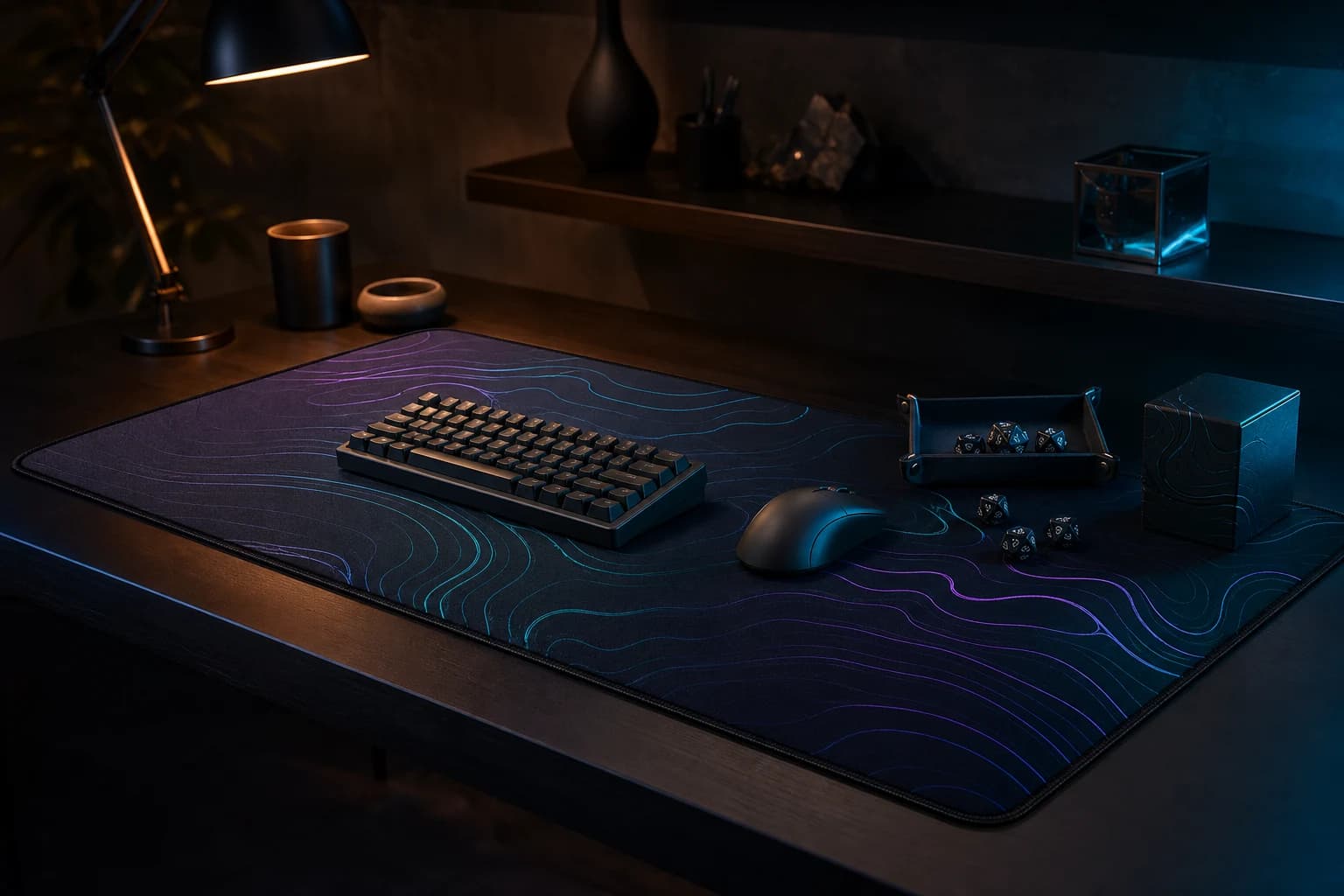 Dark gaming desk with a printed desk mat, keyboard, mouse and tabletop accessories